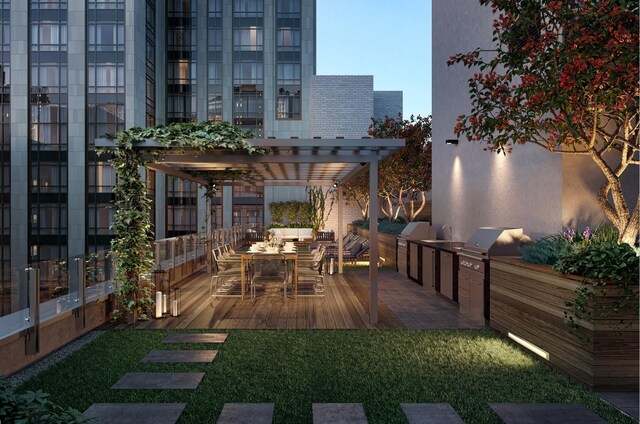 deck featuring an outdoor kitchen, a pergola, and outdoor dining area