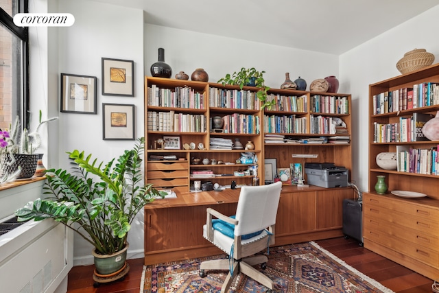 home office with dark hardwood / wood-style floors