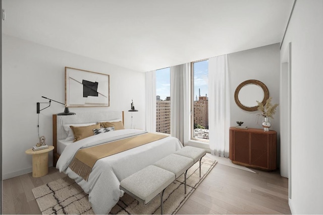 bedroom featuring light hardwood / wood-style flooring and floor to ceiling windows