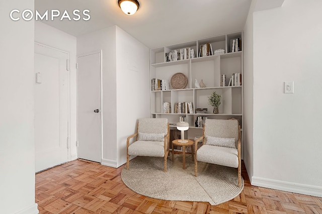 living area with light parquet flooring