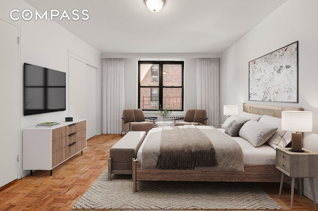 bedroom featuring light parquet floors