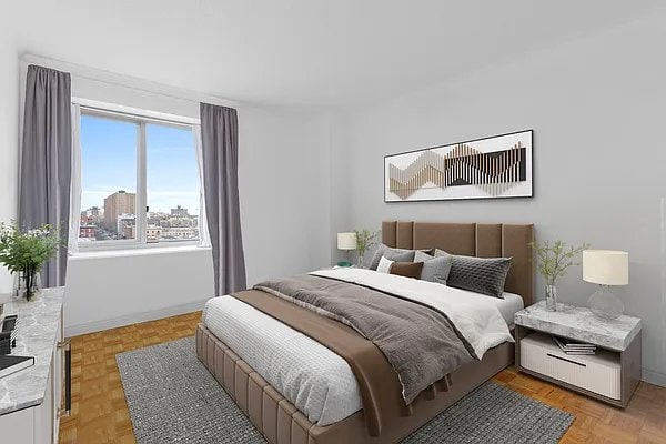 bedroom with light parquet flooring