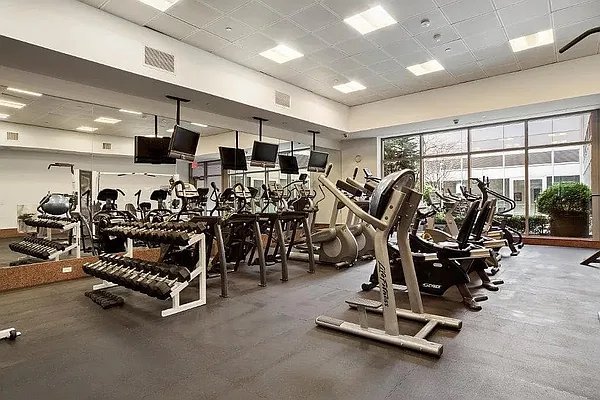 workout area featuring a drop ceiling