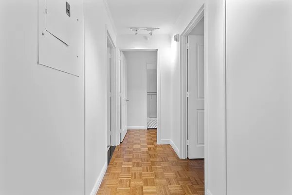 hall featuring light parquet flooring