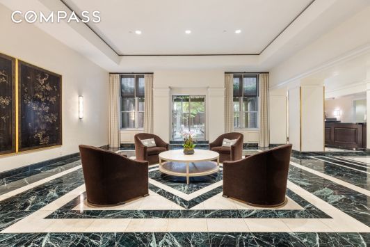 workout area featuring a paneled ceiling