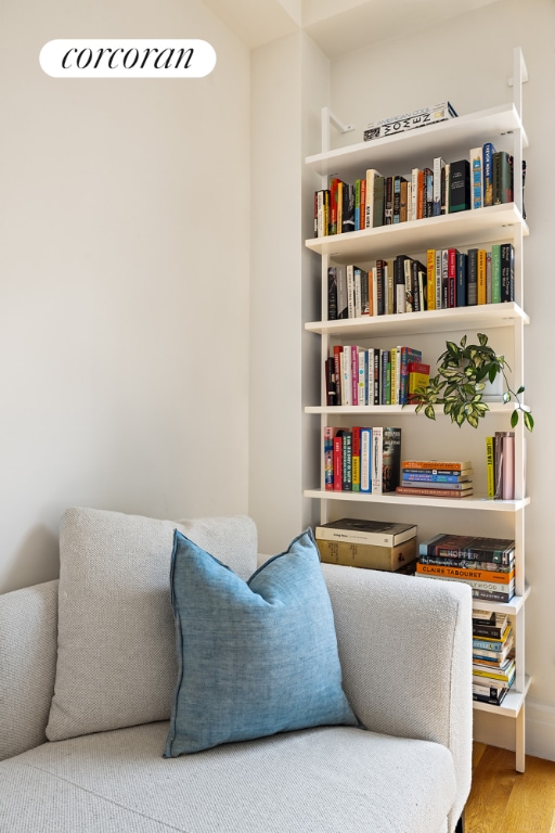 sitting room with hardwood / wood-style flooring