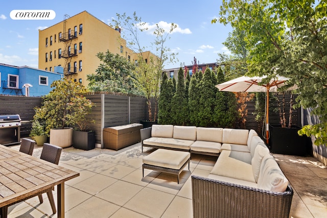 view of patio with an outdoor living space and a grill