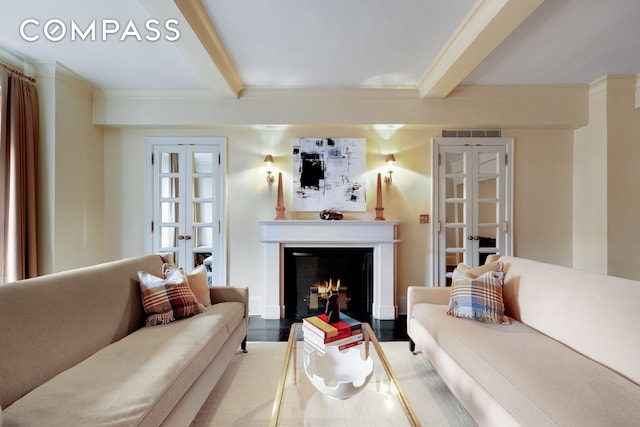 living room featuring a warm lit fireplace, beam ceiling, visible vents, and french doors