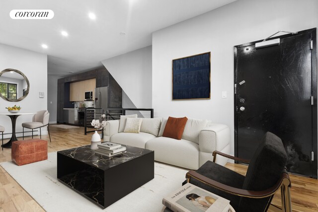 bedroom featuring wood-type flooring and baseboard heating