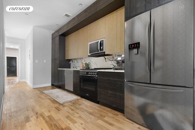 bedroom with hardwood / wood-style flooring and brick wall