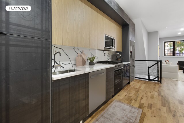 bedroom featuring a baseboard heating unit and hardwood / wood-style floors