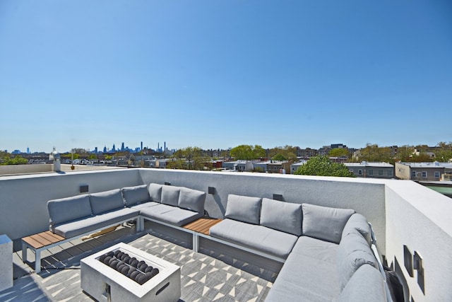 deck featuring an outdoor hangout area and a city view