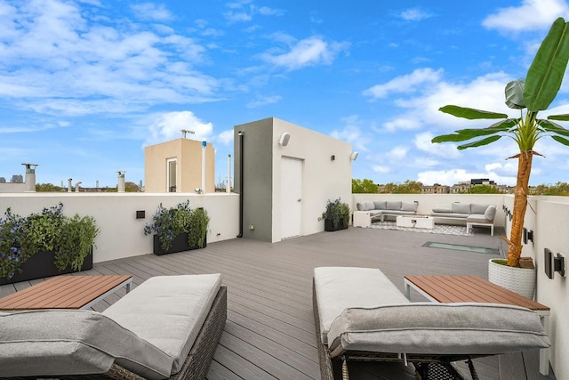 wooden deck with outdoor lounge area