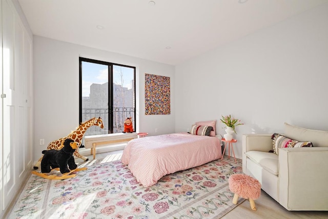 bedroom with light wood-style floors