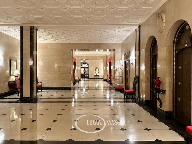 unfurnished room featuring ornamental molding and hardwood / wood-style floors