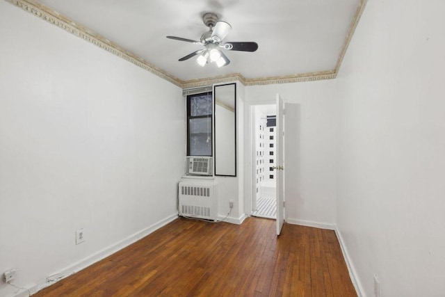 unfurnished room with ceiling fan, radiator heating unit, and dark hardwood / wood-style flooring