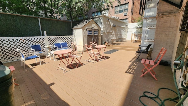 wooden deck with a storage unit