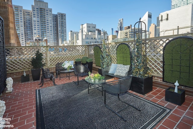 view of patio / terrace featuring a view of city