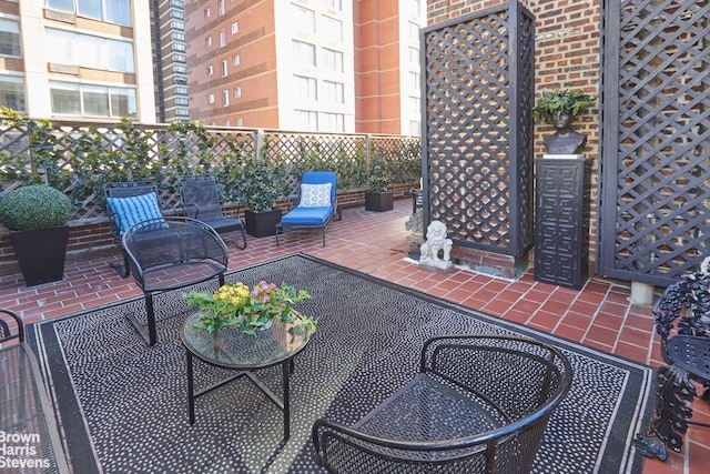 view of patio / terrace featuring fence