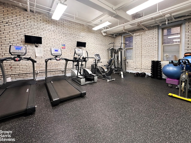 workout area with brick wall