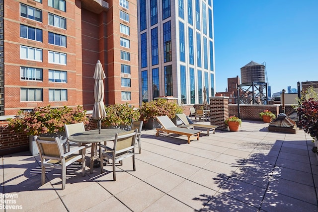 view of patio / terrace featuring a city view and outdoor dining space