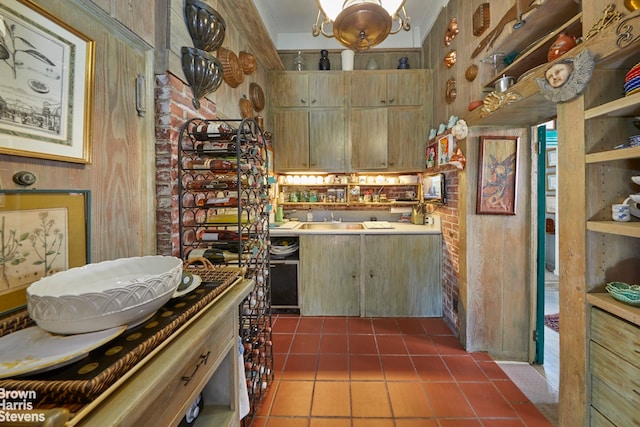 kitchen featuring dark tile patterned flooring and sink