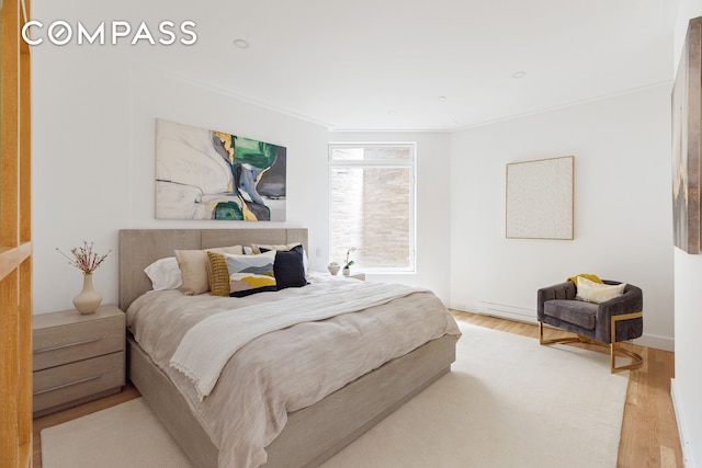 bedroom with wood finished floors