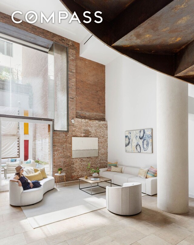 16 Jay St Unit 1, New York City, NY 10013 - common area with a towering ceiling and brick wall