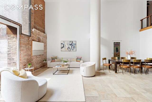 16 Jay St Unit 1, New York City, NY 10013 - living area featuring a towering ceiling and brick wall