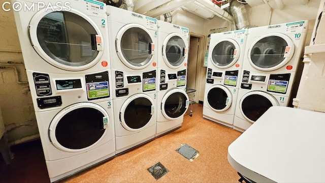 clothes washing area featuring stacked washer and dryer and washer and dryer