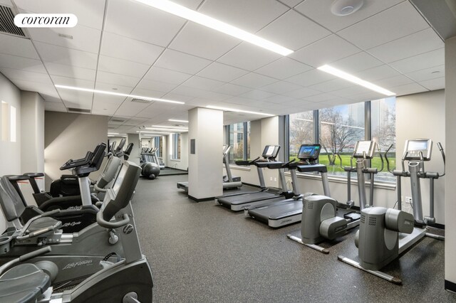 gym with visible vents and a drop ceiling