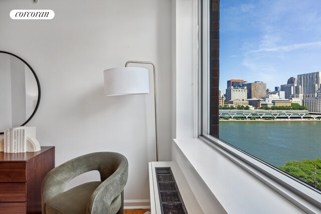 425 Main St Unit 12D, New York City, NY 10044 - sitting room with baseboards and a view of city