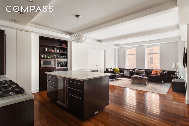 kitchen featuring open shelves, dark brown cabinetry, dark wood-style flooring, and hanging light fixtures