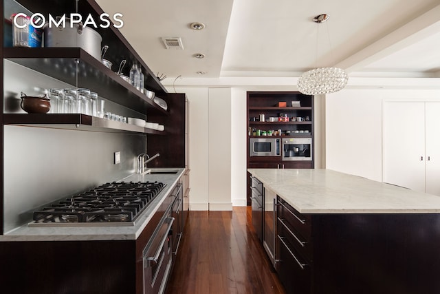 kitchen featuring visible vents, a notable chandelier, open shelves, a sink, and stainless steel appliances