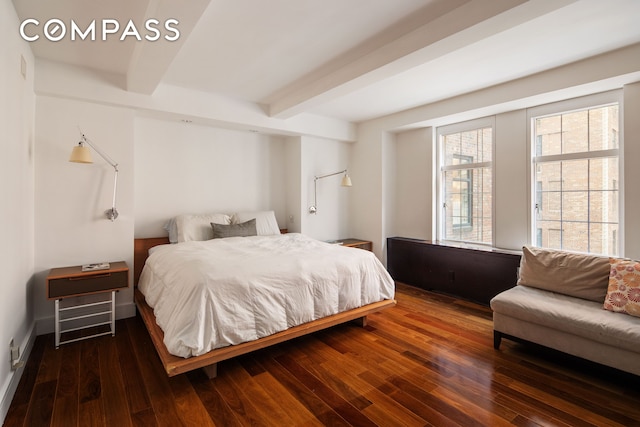 bedroom featuring beamed ceiling and wood-type flooring