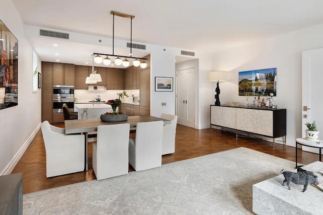 dining room featuring dark parquet floors