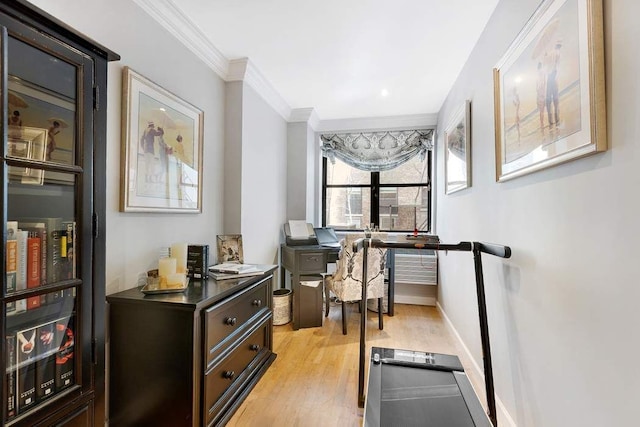 57 E 75th St Unit 2R, New York City, NY 10021 - home office featuring crown molding, light wood-style flooring, and baseboards