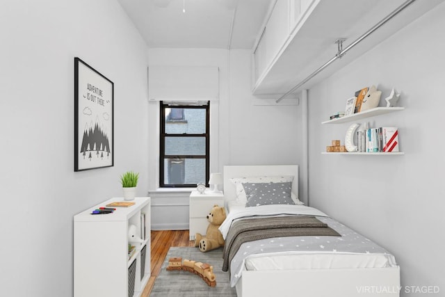 bedroom with wood-type flooring