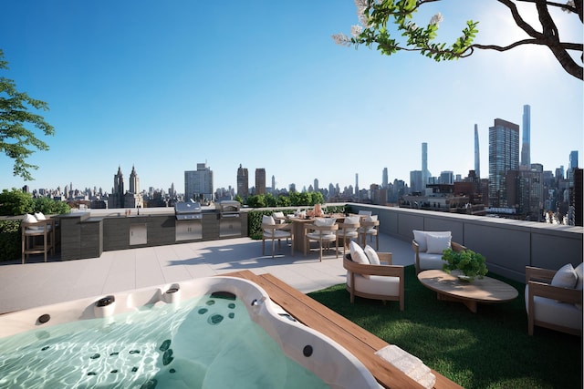 view of patio with a grill, a view of city, hot tub deck surround, and exterior kitchen