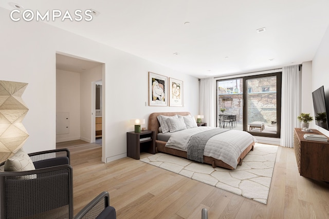 bedroom featuring light wood-style floors