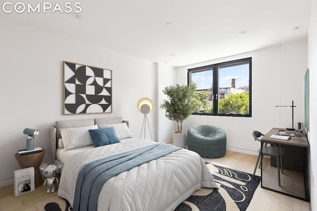 bedroom featuring light wood-type flooring