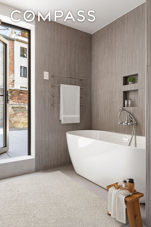 bathroom featuring a soaking tub