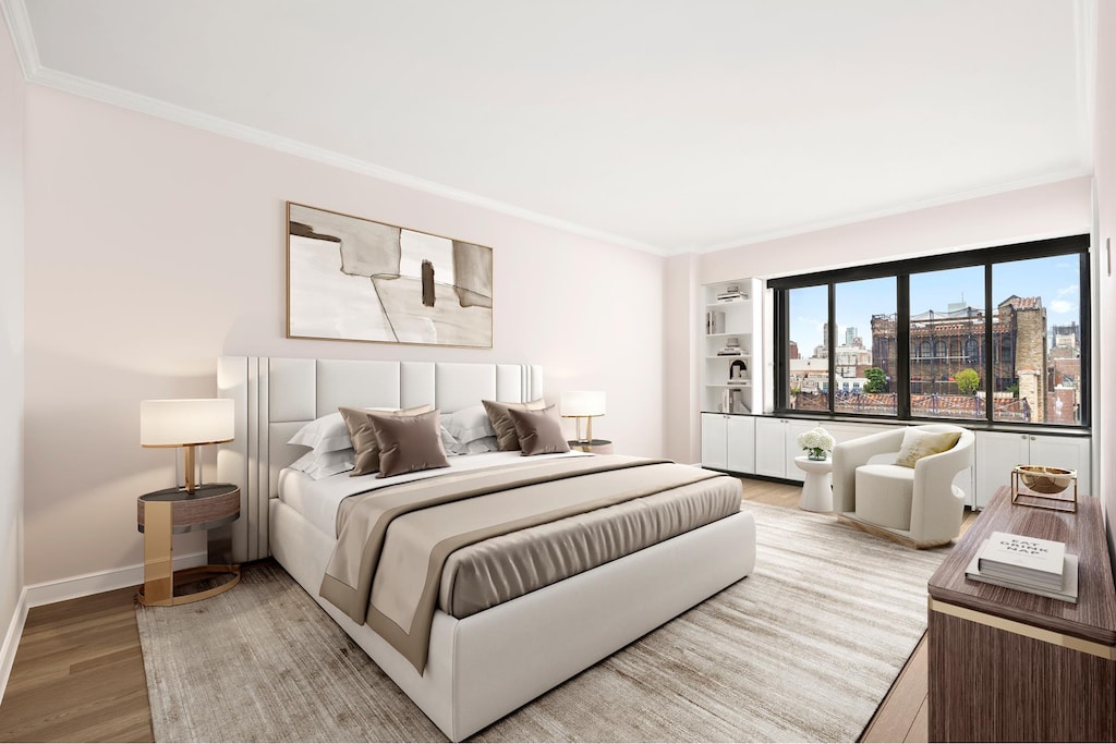 900 Park Ave Unit 18D, New York City, NY 10021 - bedroom with light wood-style flooring, baseboards, and ornamental molding