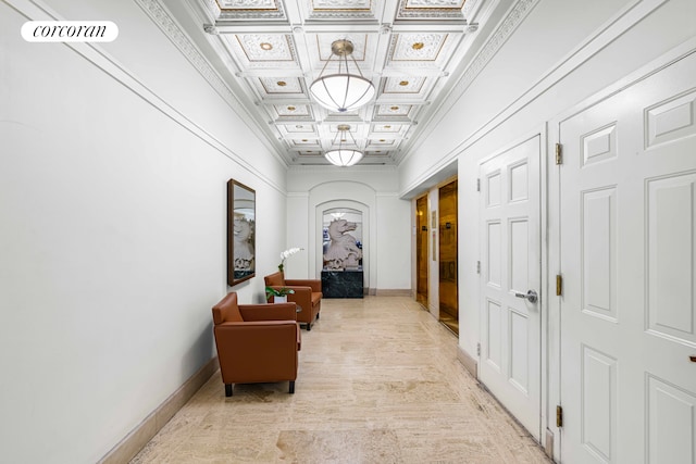 hall featuring crown molding, visible vents, a high ceiling, coffered ceiling, and baseboards