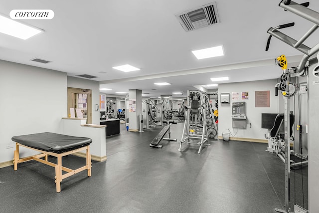 gym with baseboards and visible vents