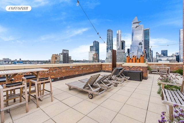 view of patio / terrace featuring a city view