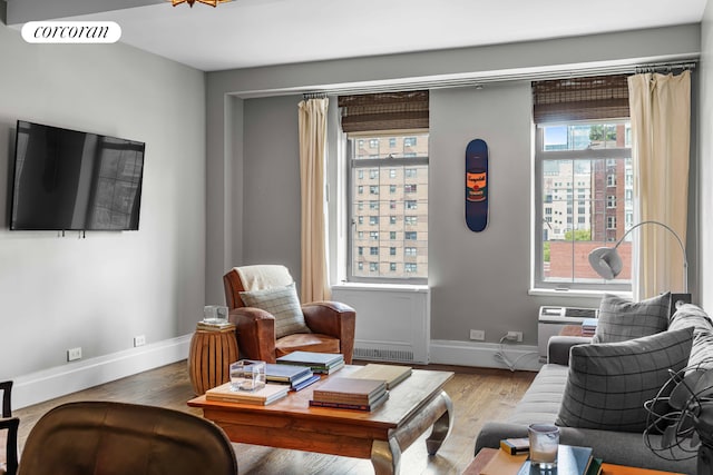 interior space featuring wood finished floors, visible vents, and baseboards