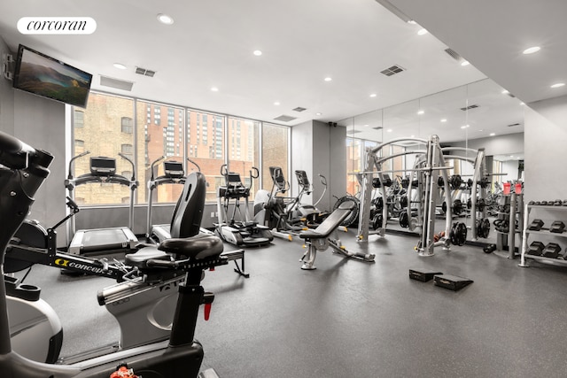 workout area featuring visible vents and recessed lighting