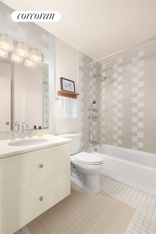 bathroom with visible vents, toilet, vanity, shower / tub combination, and tile patterned floors