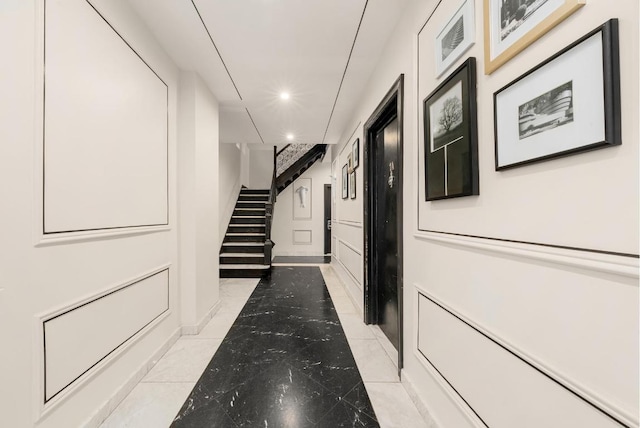 hallway featuring light tile patterned floors